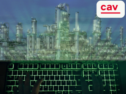 Grün leuchtende Tastaturabbildung mit Fabrik im Hintergrund.